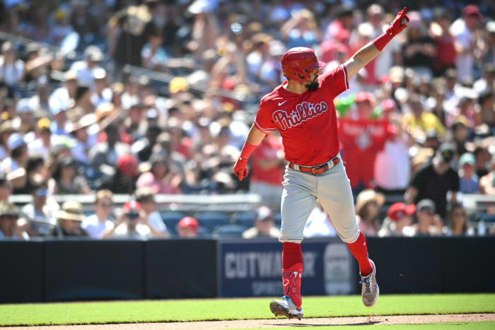 Kyle Schwarber celebrates after hitting a go-ahead three-run home run in San Diego against the Padres.